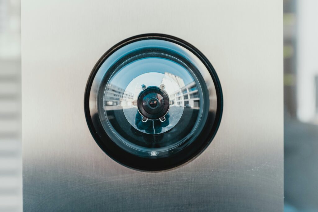 A secure building, reflected in a camera's lens
