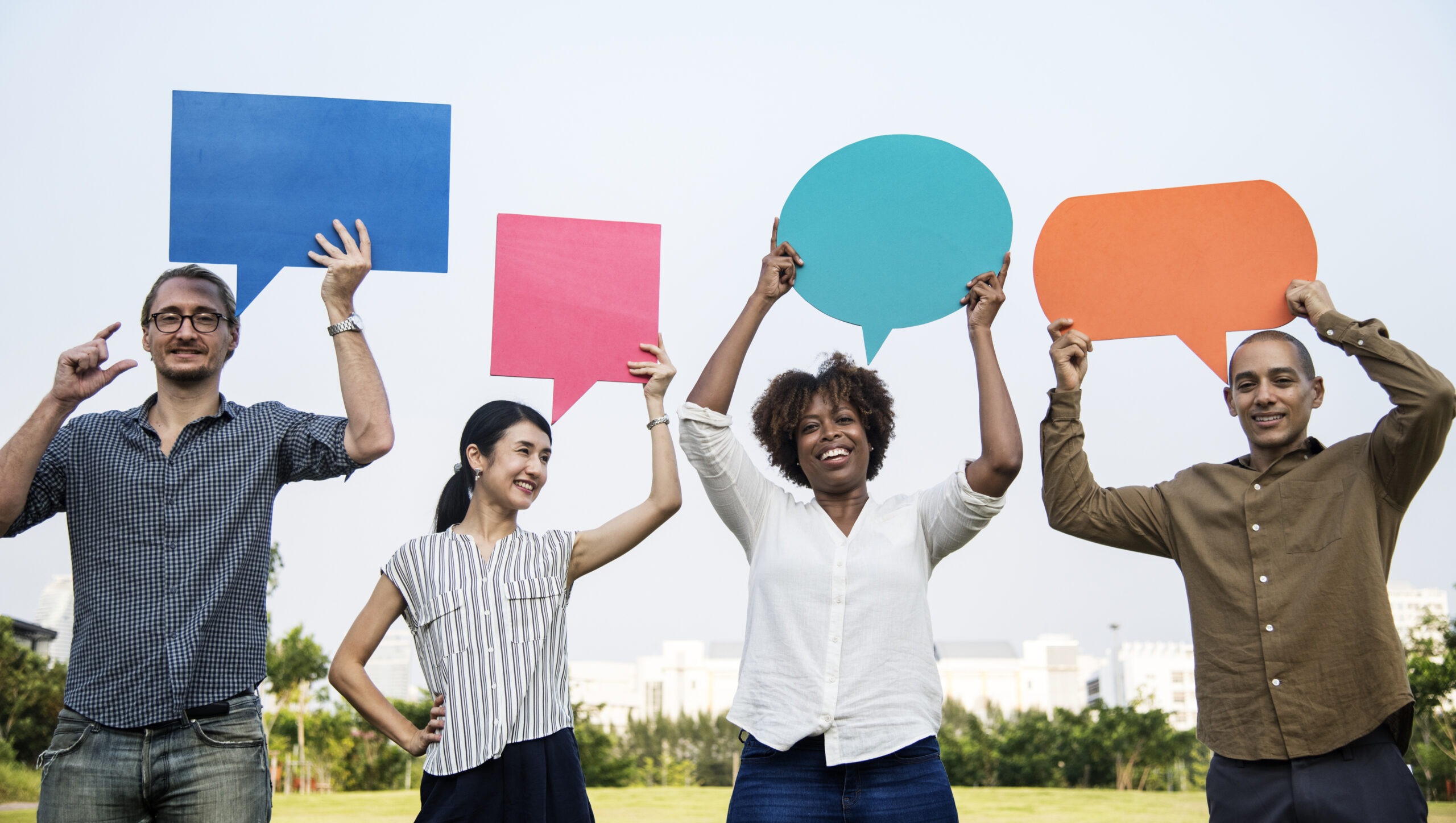 Diverse friends holding speech bubbles